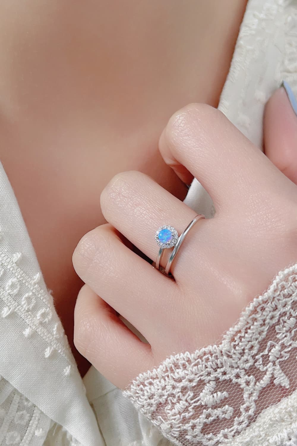Close-up of a white opal solitaire ring in platinum-plated 925 sterling.