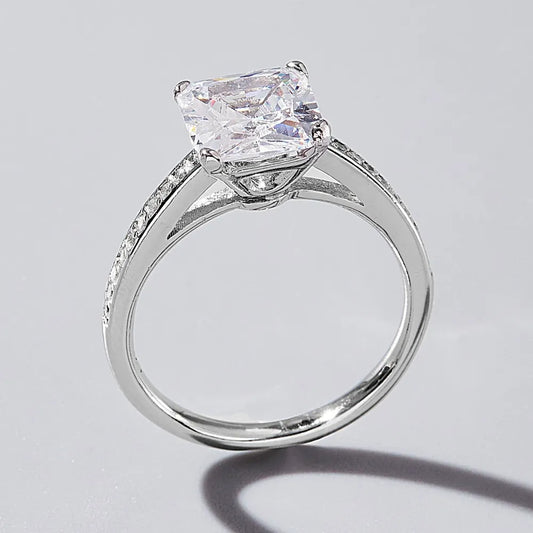 Side profile of zircon ring showing band and four-prong setting