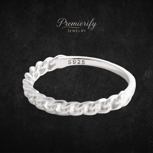 Silver ring with braided design on a dark background, featuring 'Premierify Jewelry' branding.