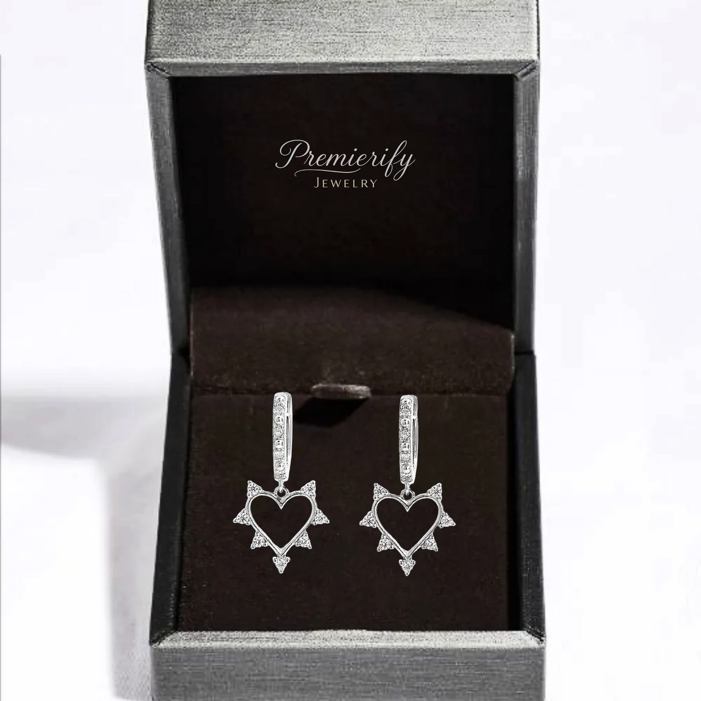 Heart-shaped earrings in a Premierify Jewelry box on a white background
