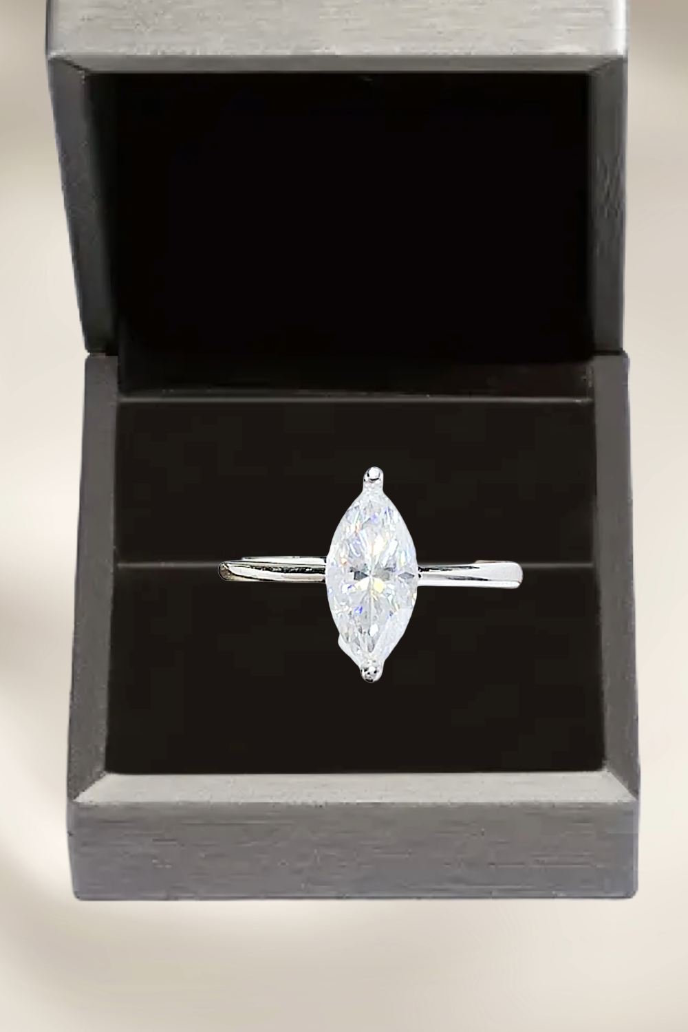 Marquise-shaped diamond ring in a black box