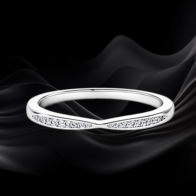 Silver accent ring on a black background.