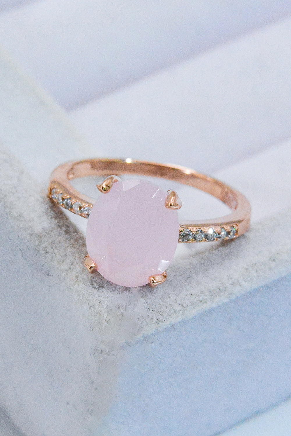 Close-up of rose quartz center with subtle pavé accents