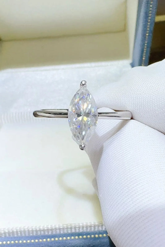 "Serenata Marquise 2 Carat Moissanite Solitaire Ring in platinum-plated 925 sterling silver with elongated marquise cut stone on prong setting."