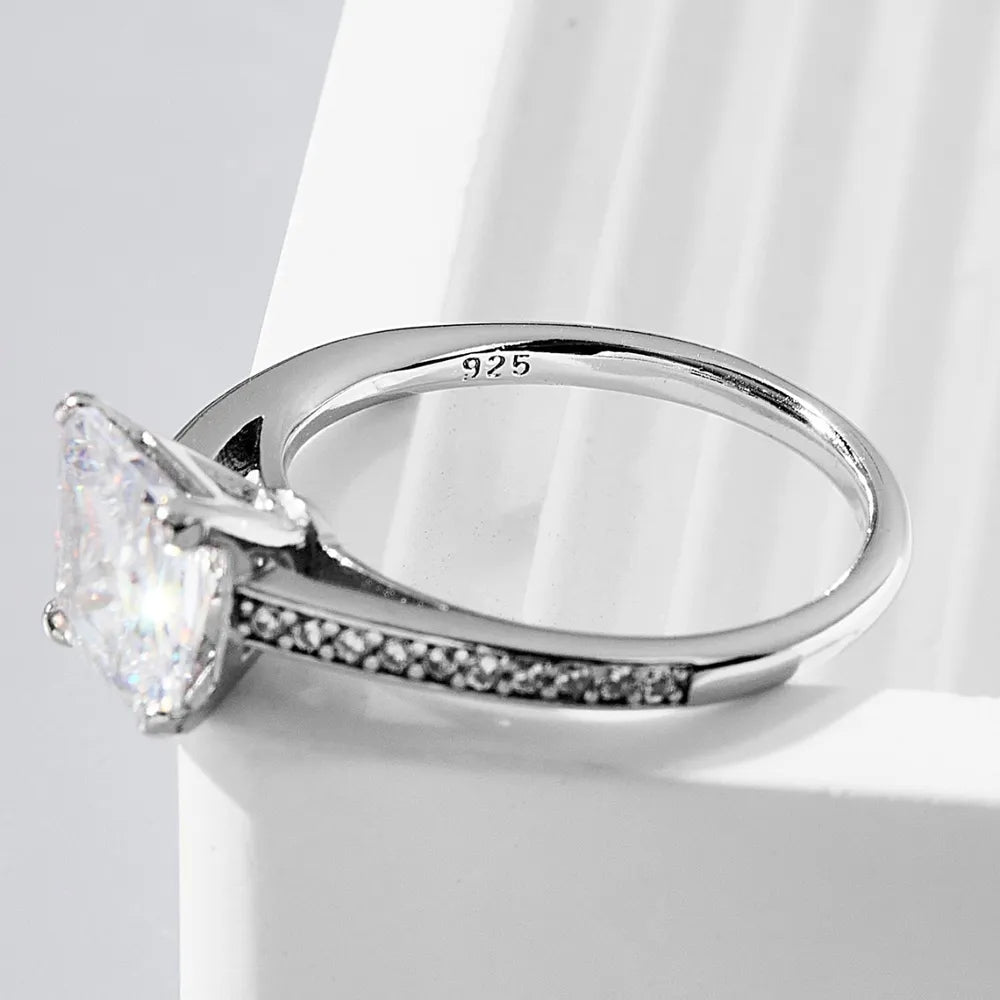Rayeau™ zircon ring displayed flat, showcasing radiant-cut sparkle and minimalist design