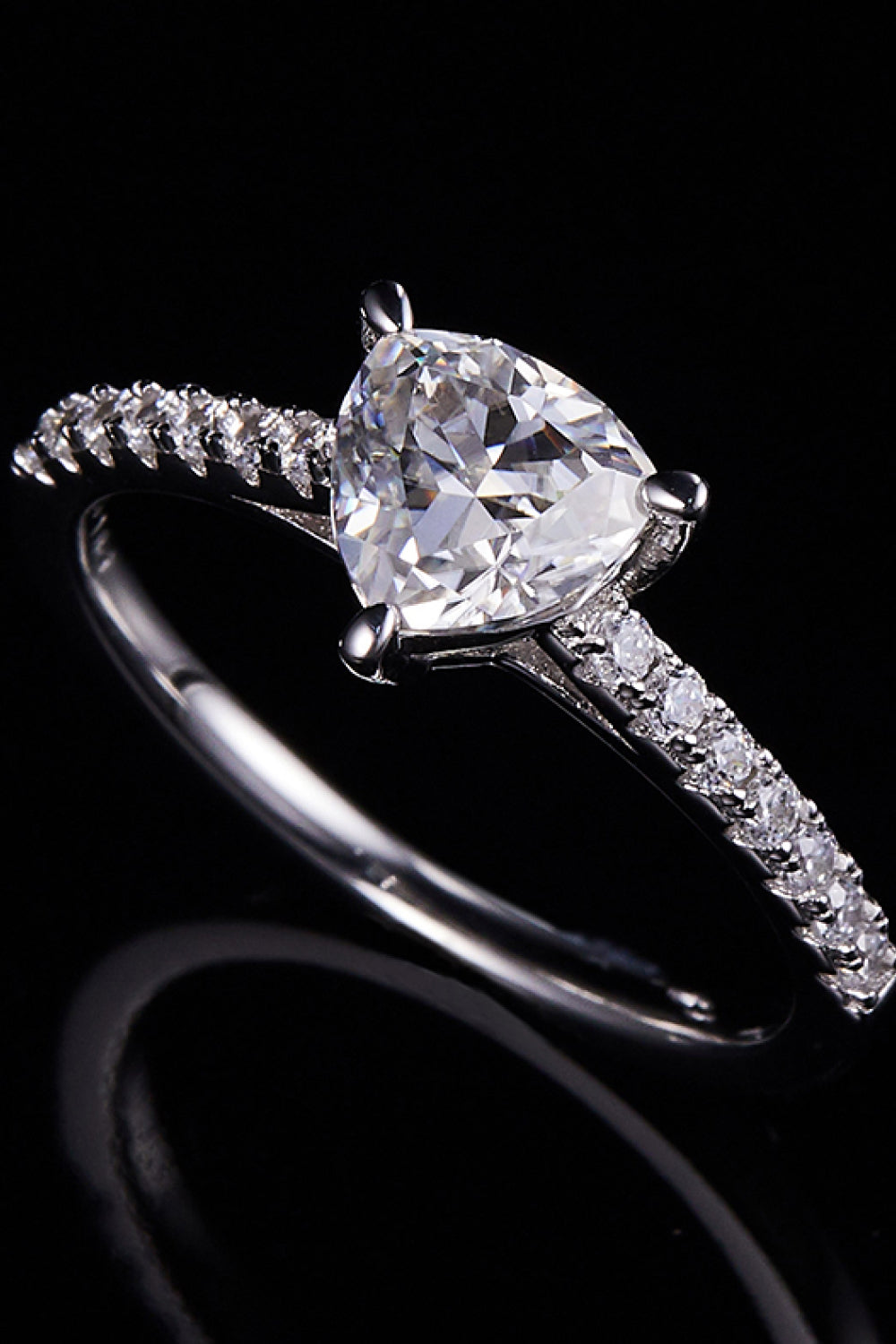 TriNova™ 1ct triangle moissanite ring in platinum-plated 925 with zircon accents; includes certificate of authentication. Black background.