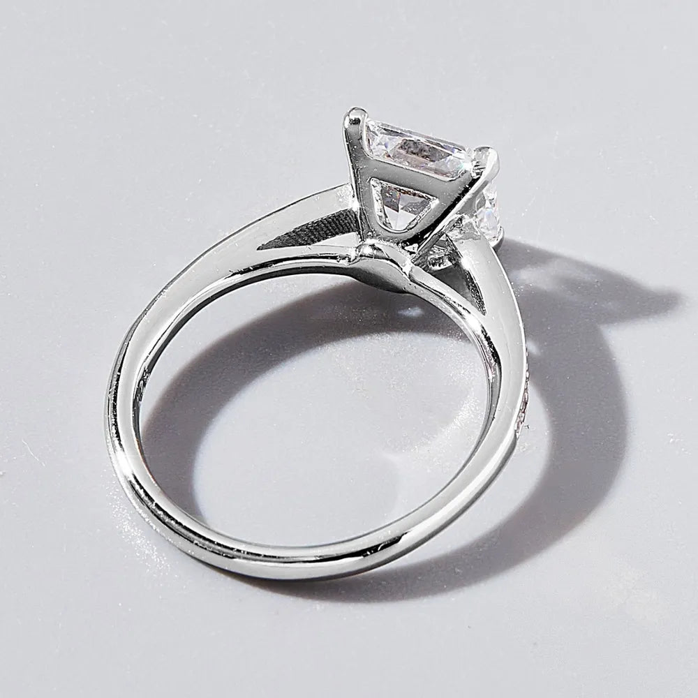Side profile of zircon ring showing band and four-prong setting