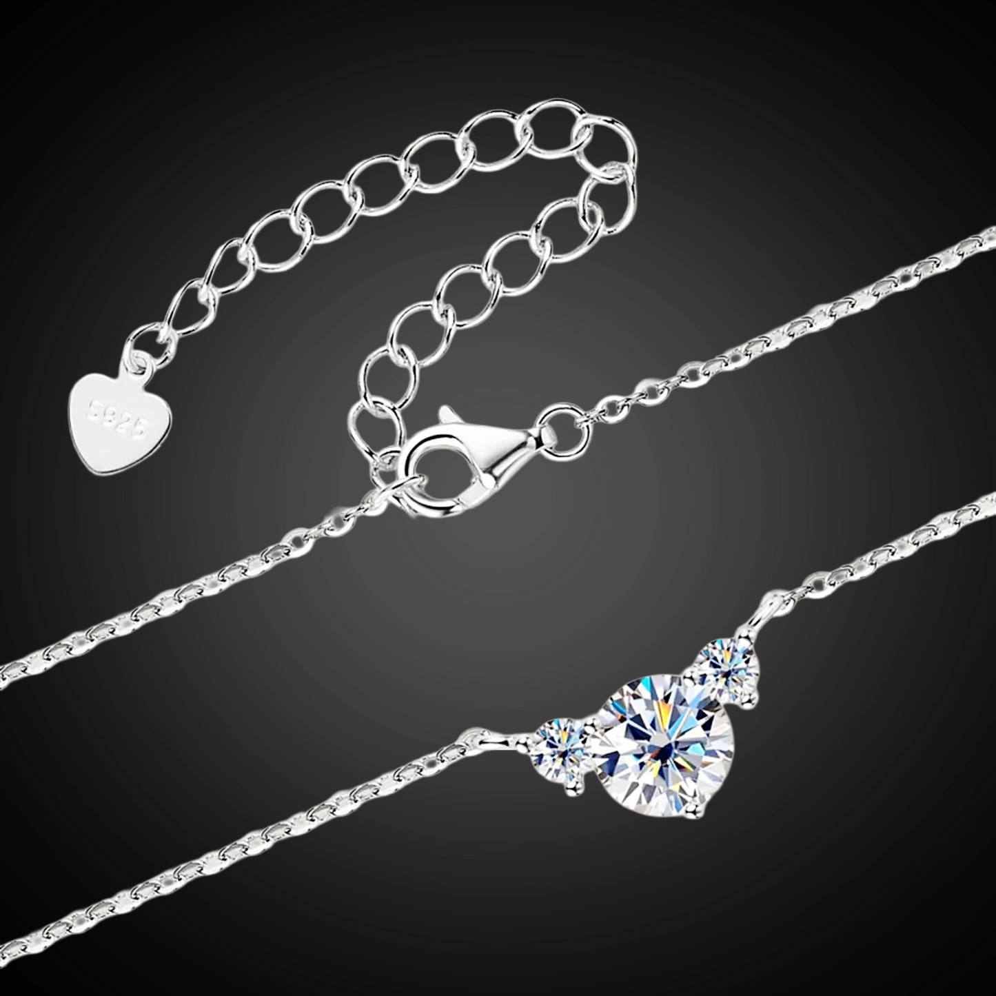 Silver necklace with a heart-shaped pendant on a black background