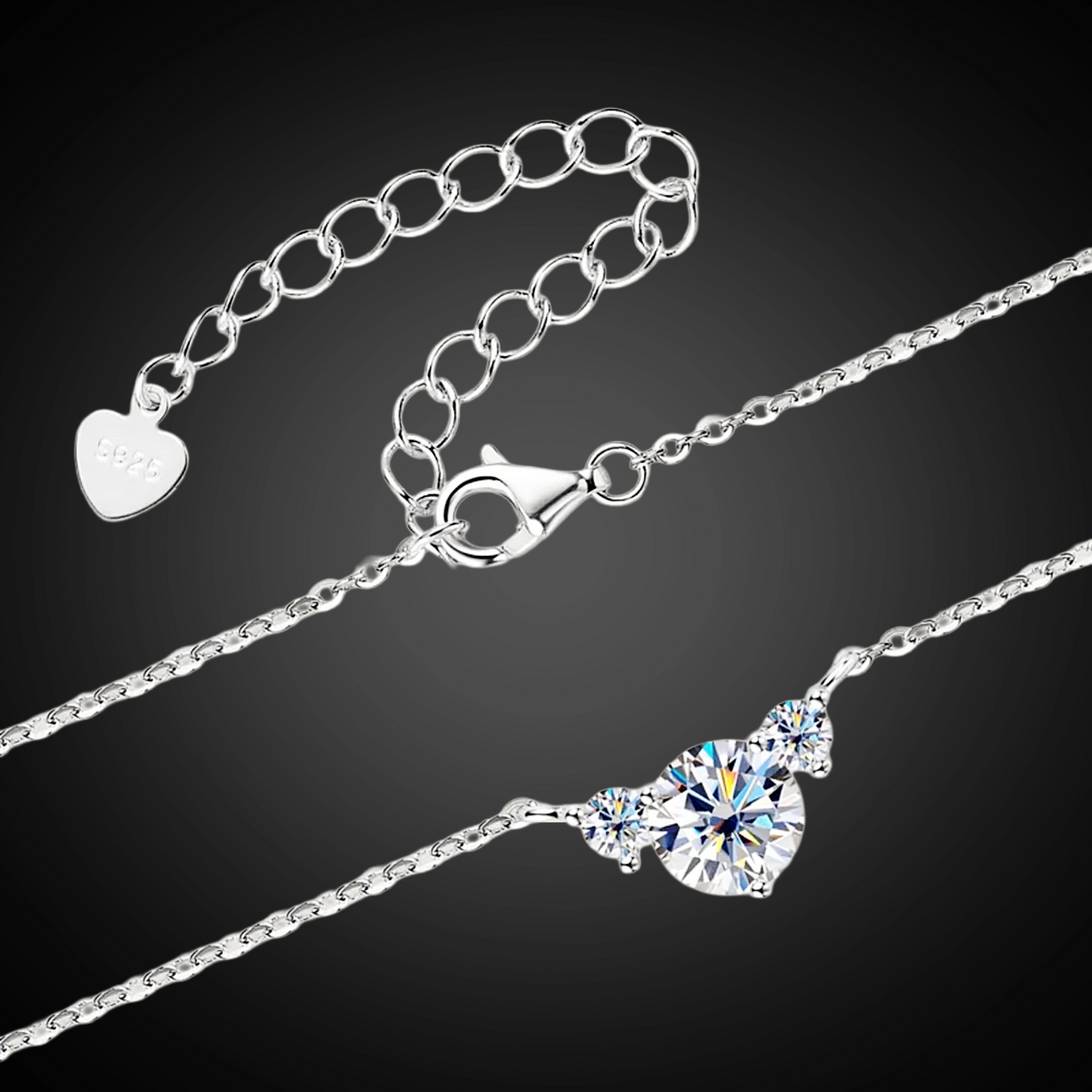 Silver necklace with a heart-shaped pendant on a black background