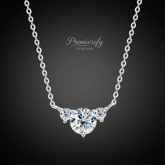Silver necklace with a heart-shaped diamond pendant on a dark background, featuring the brand 'Premierify Jewelry'.