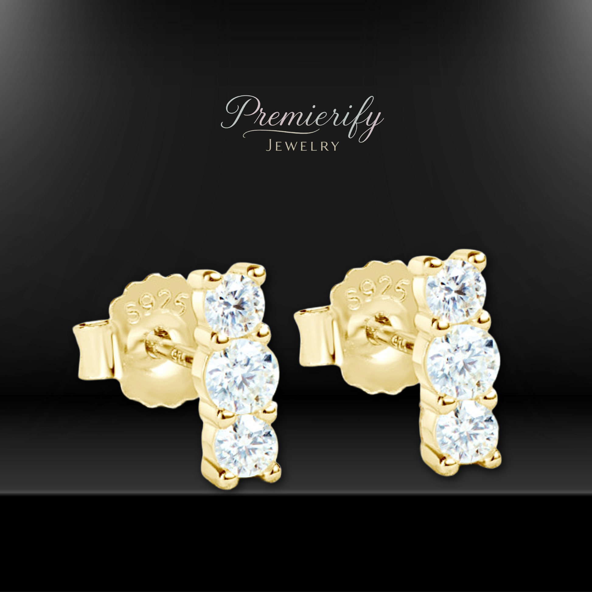 Gold earrings with clear stones on a black background, featuring the brand 'Premierify Jewelry'.