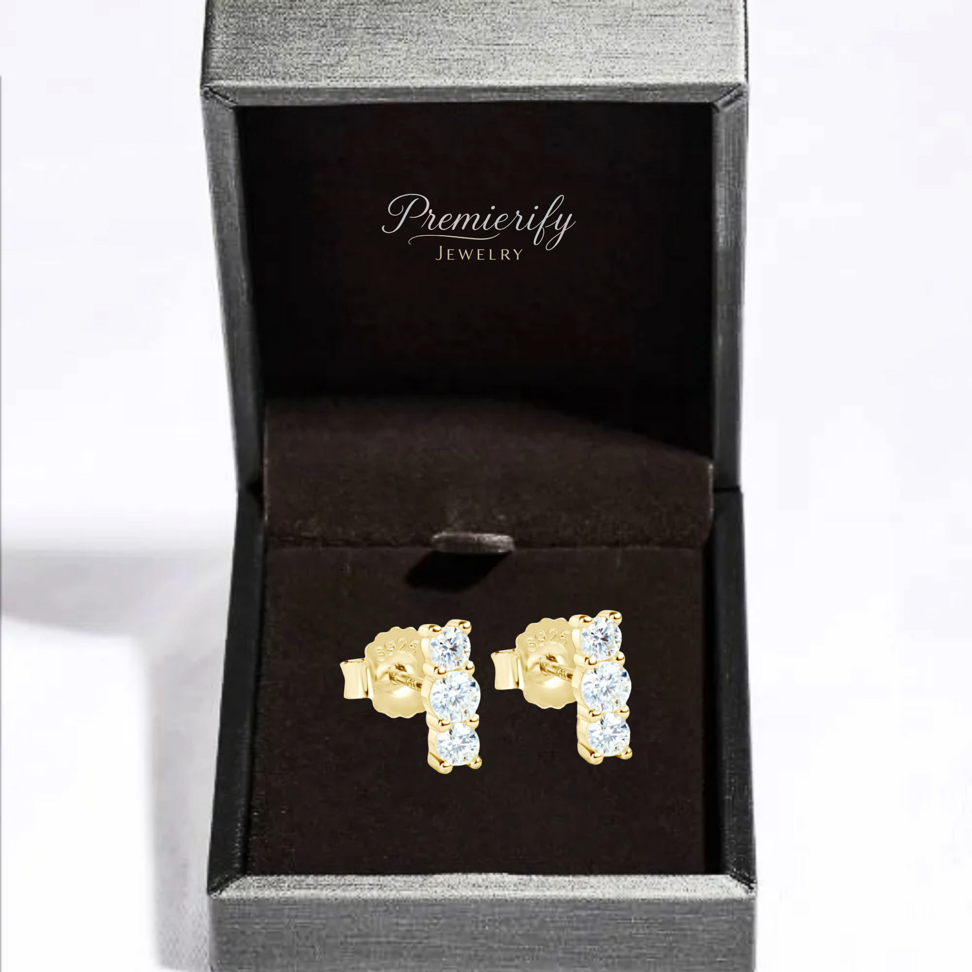 Gold earrings with clear stones in a Premierify Jewelry box