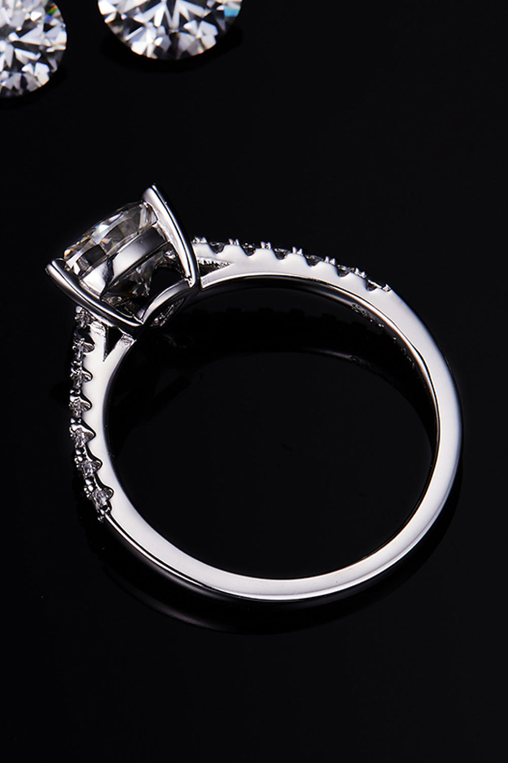 TriNova™ 1ct triangle moissanite ring in platinum-plated 925 with zircon accents;side angle.