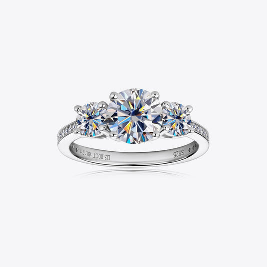 Eterna Trio™ 3 Carat Moissanite Ring in platinum-plated 925 sterling silver featuring three round-cut stones symbolizing past, present, and future.