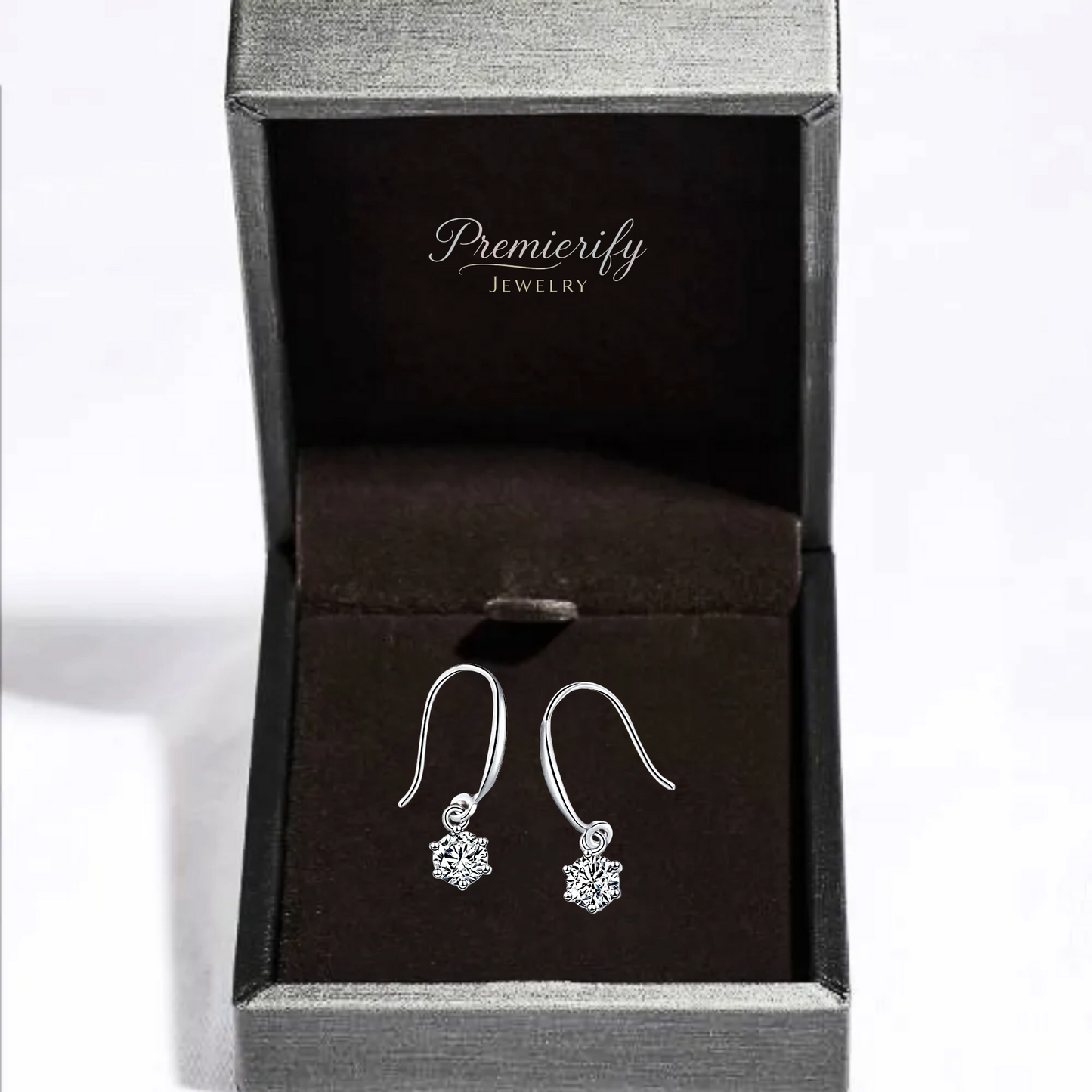 Silver earrings in a Premierify Jewelry box on a white background