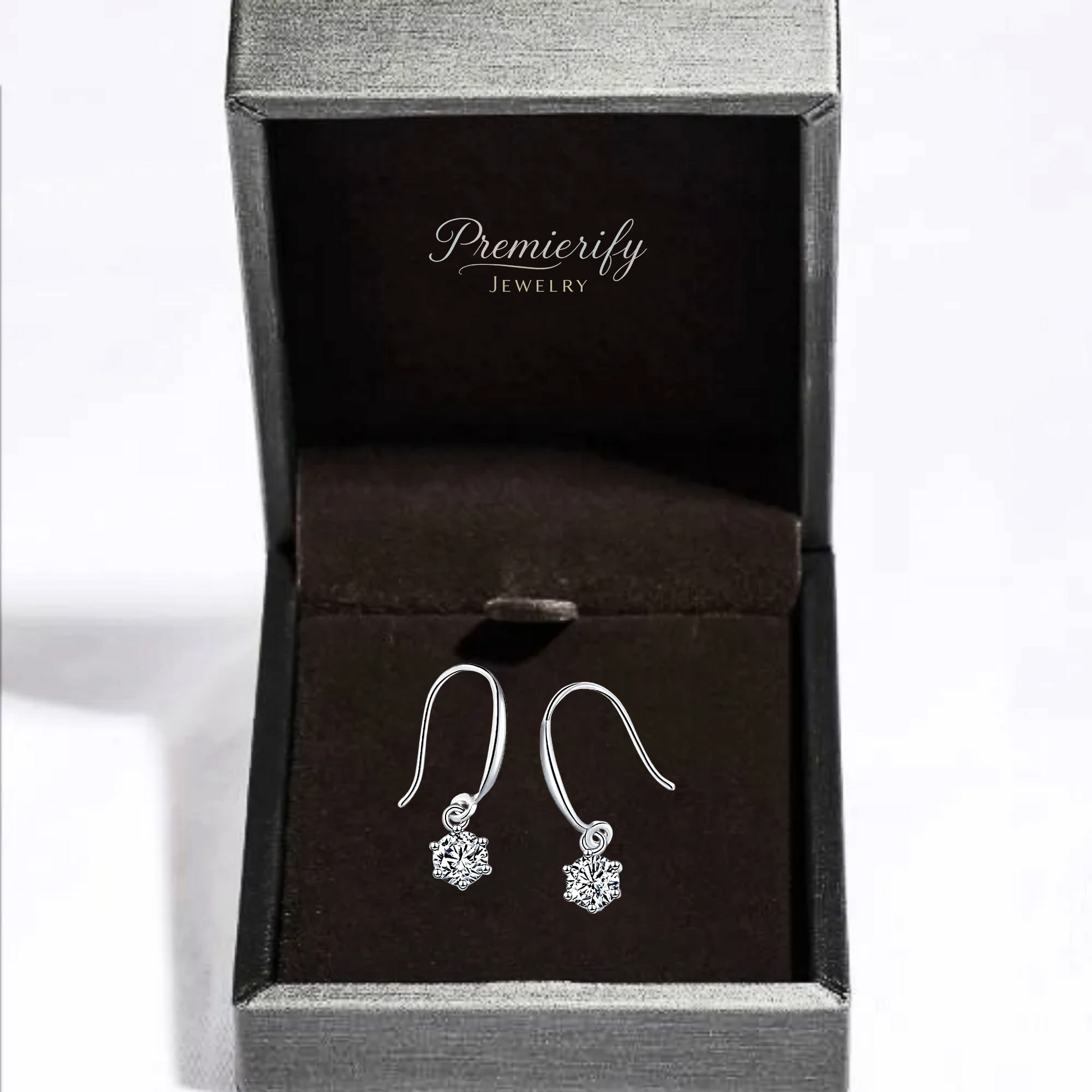 Silver earrings in a Premierify Jewelry box on a white background