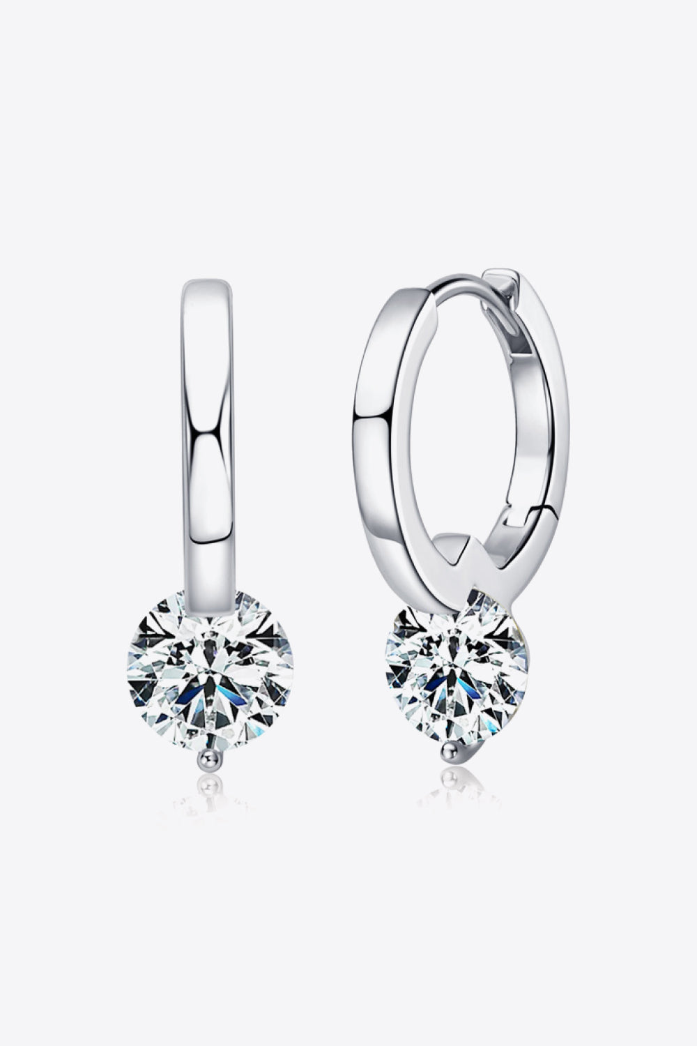 Silver moissanite earrings on white background.