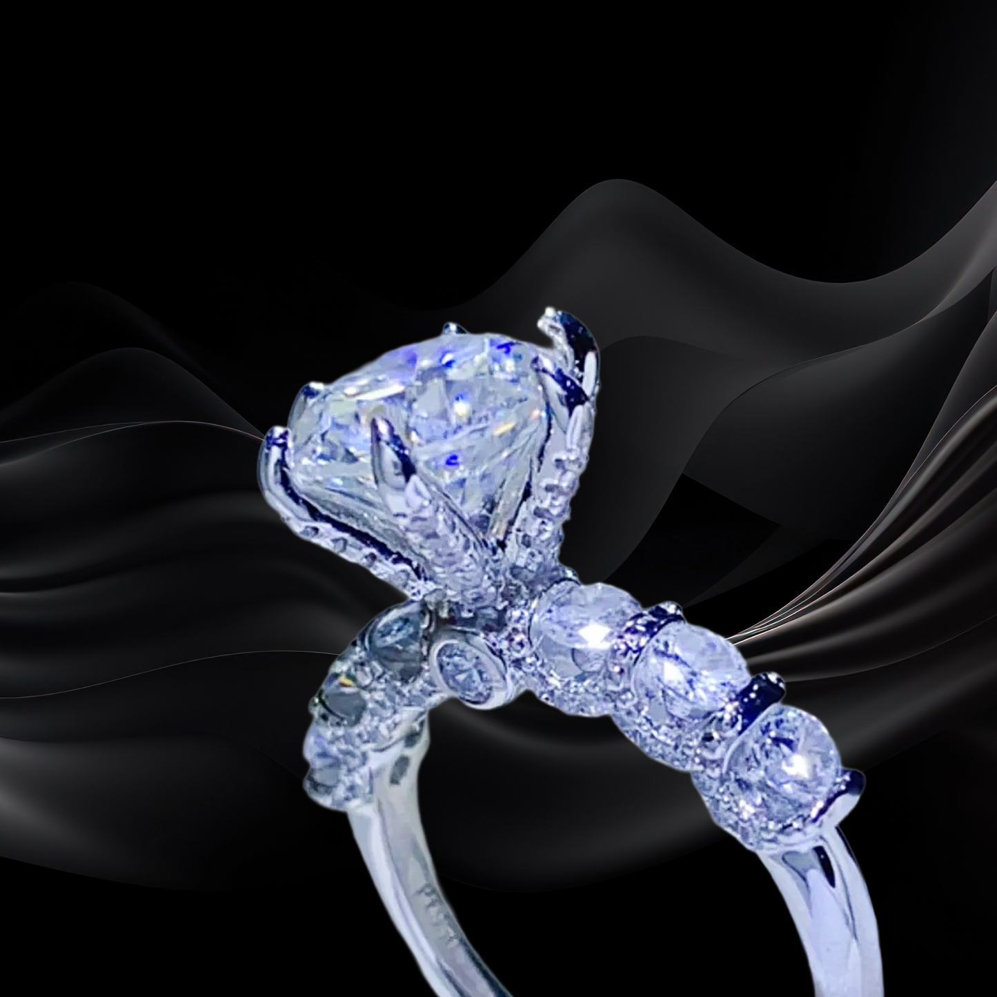 Diamond ring with a large central gemstone on a black fabric background