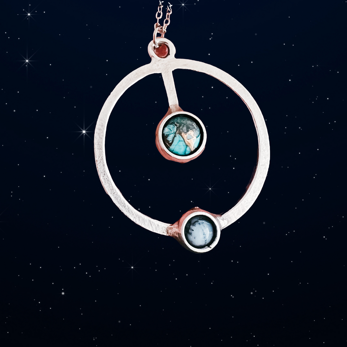 Necklace with circular pendant against a starry night sky background