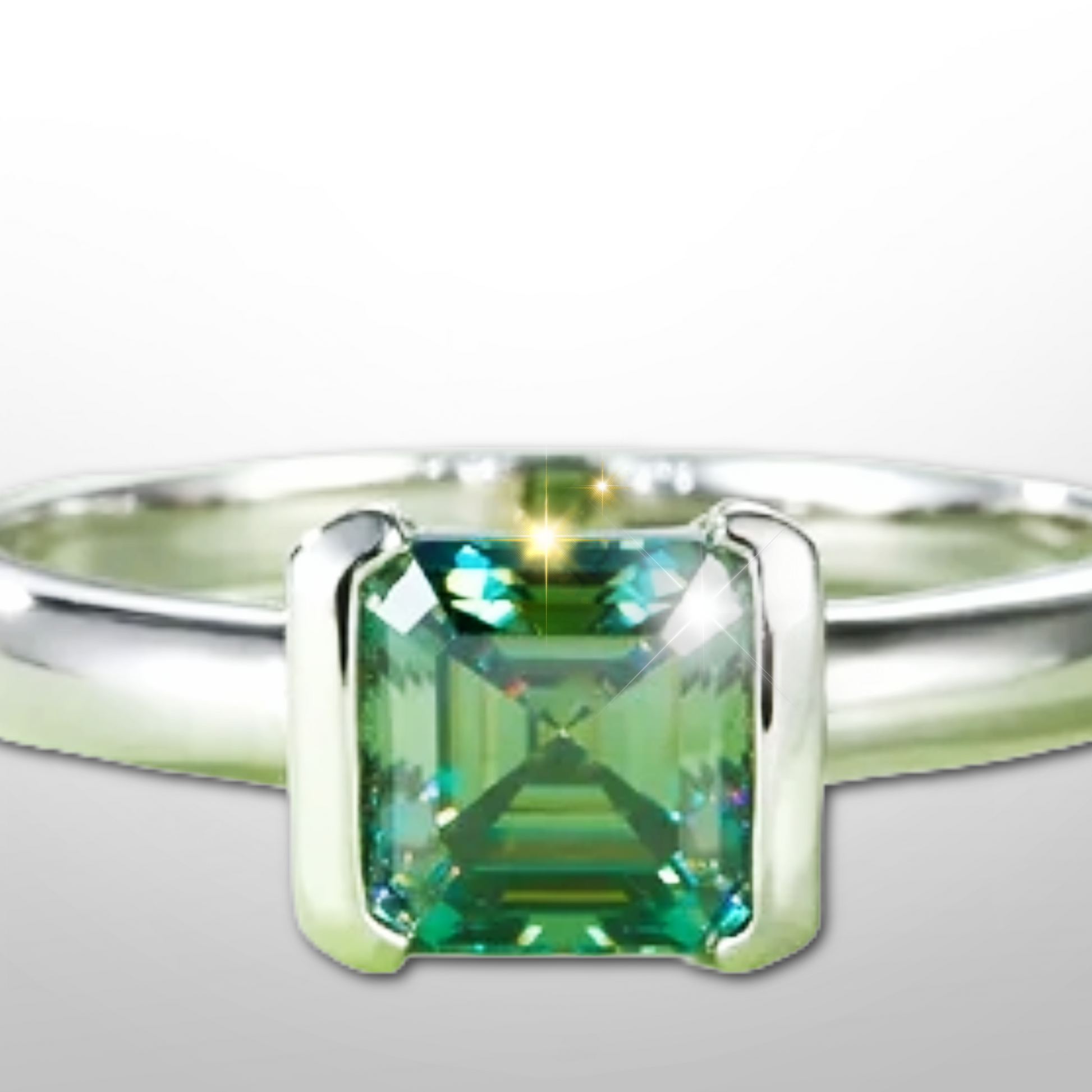 Close-up of asscher-cut sea-glass green moissanite set in sleek bezel on platinum-plated sterling band.
