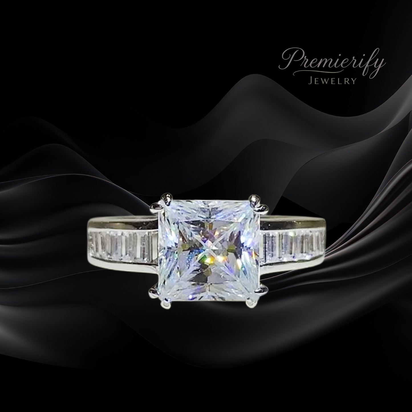 Diamond ring with a large central gemstone on a black fabric background, featuring the brand 'Premierify Jewelry'.