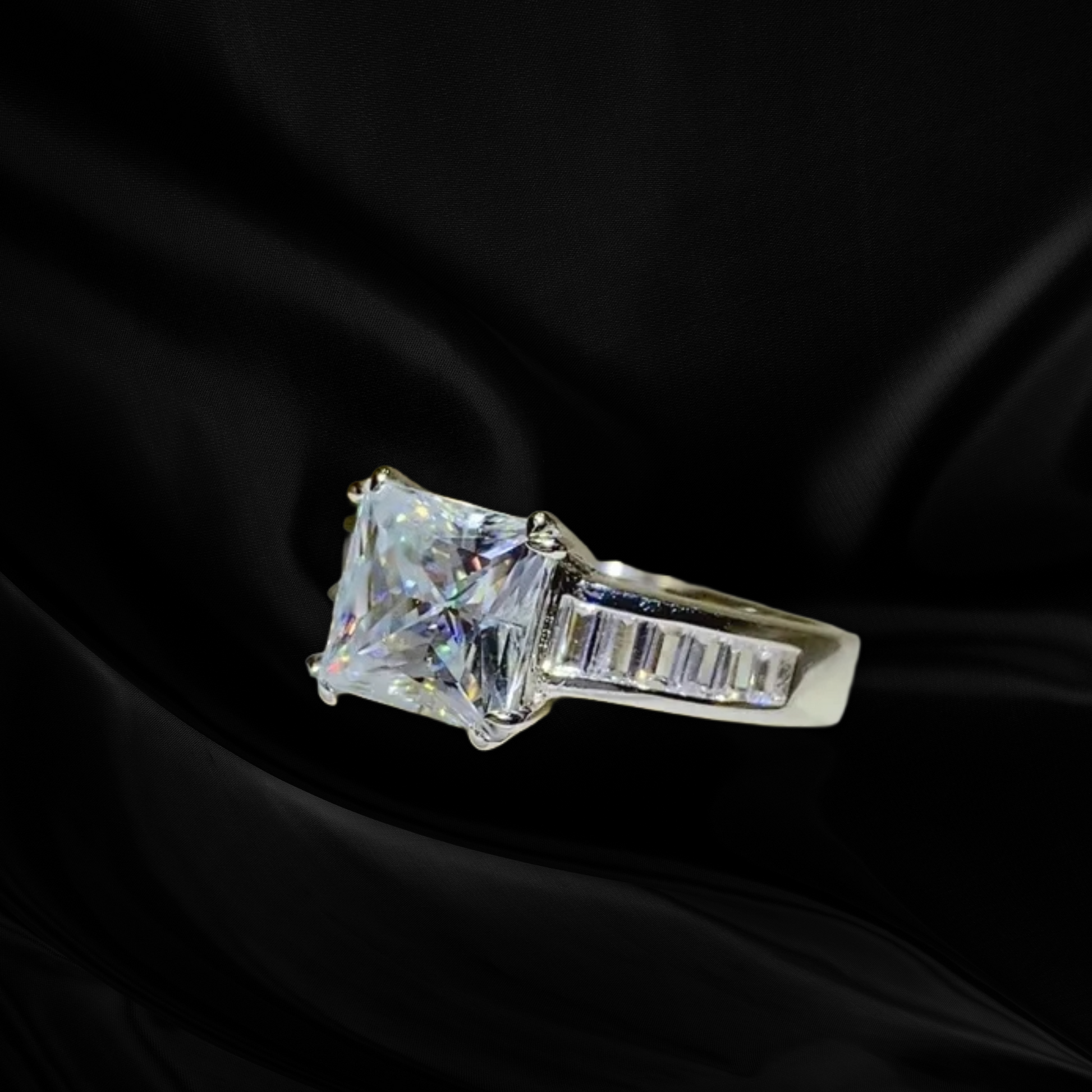 Diamond ring on a black fabric background