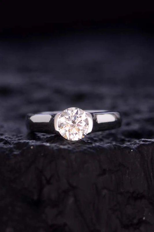 "Axisline™ 1.5 carat bezel-set moissanite solitaire ring.
