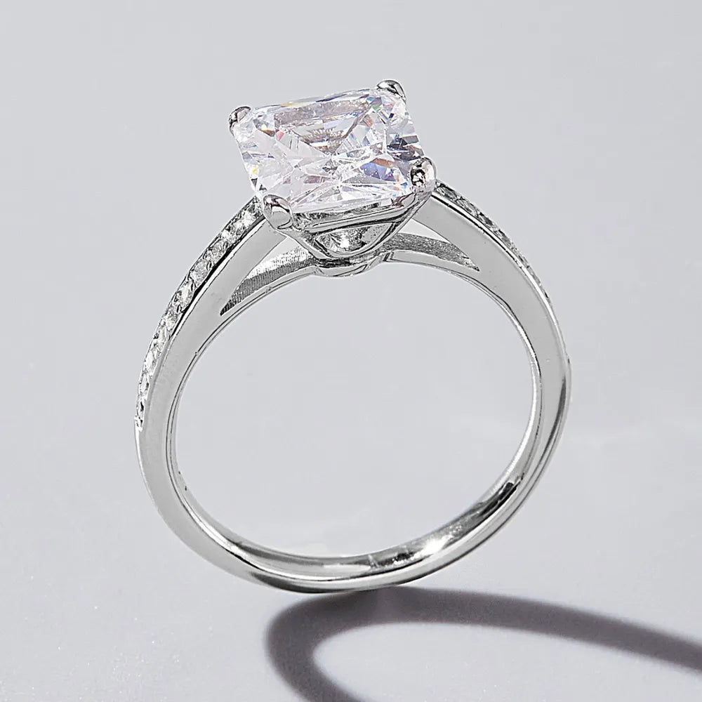 Side profile of zircon ring showing band and four-prong setting