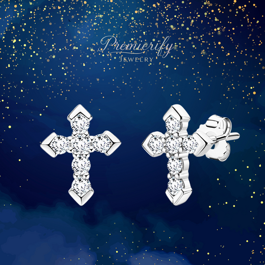 Silver cross earrings with clear stones on a blue background with gold glitter, featuring the brand 'Premierify Jewelry'.