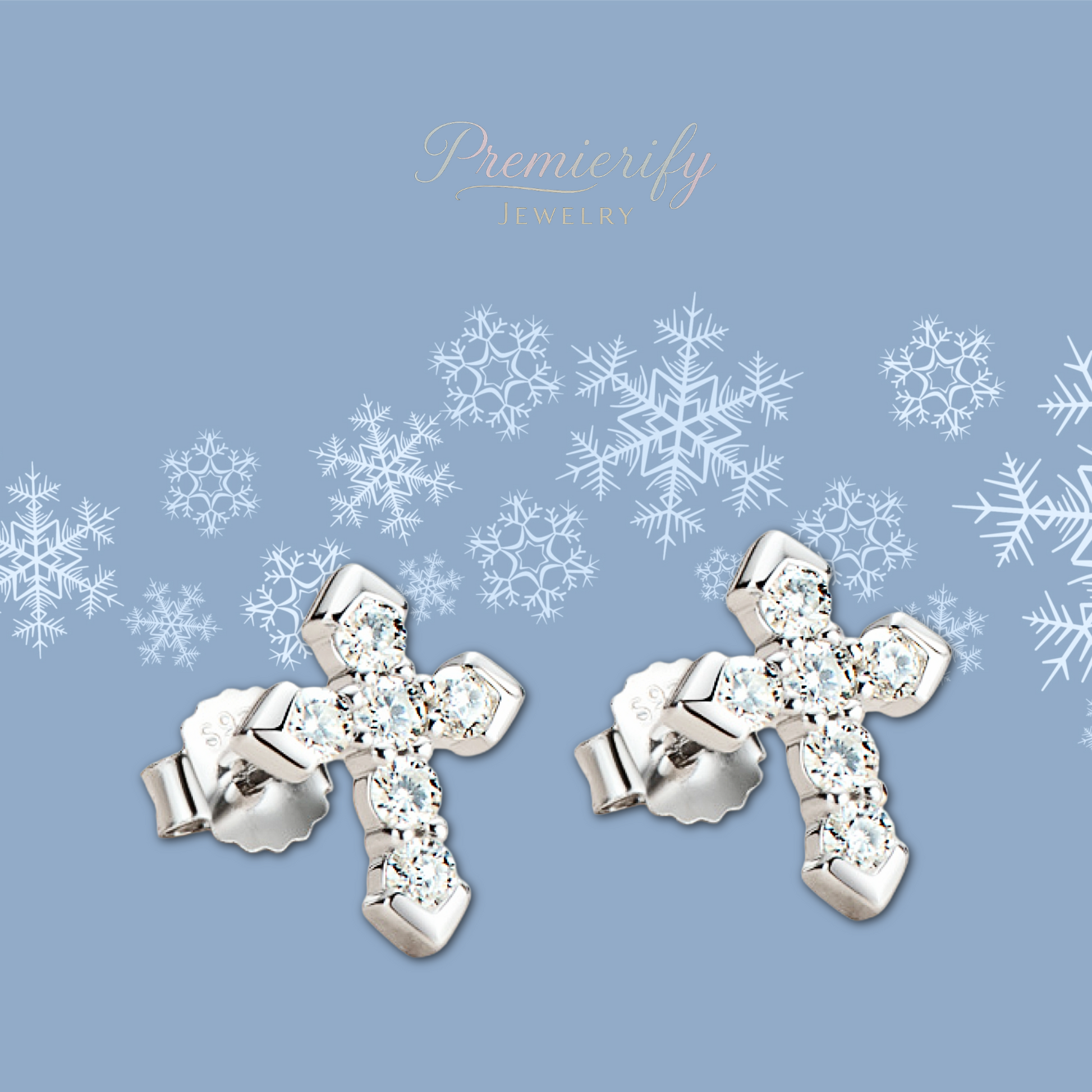 Silver cross earrings with clear stones on a blue background with snowflake patterns, featuring the brand 'Premierify'.