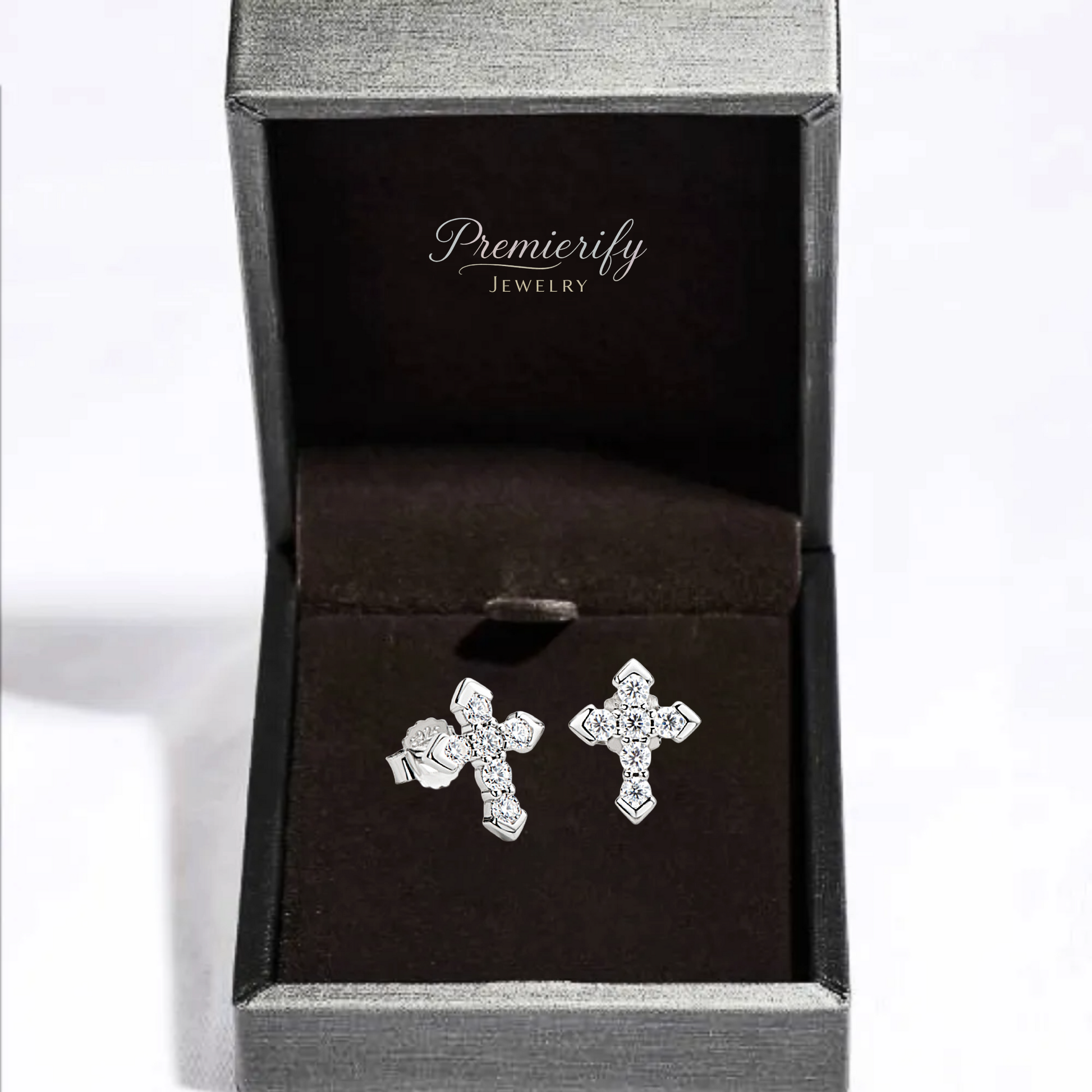 Silver cross earrings in a Premierify Jewelry box on a white background
