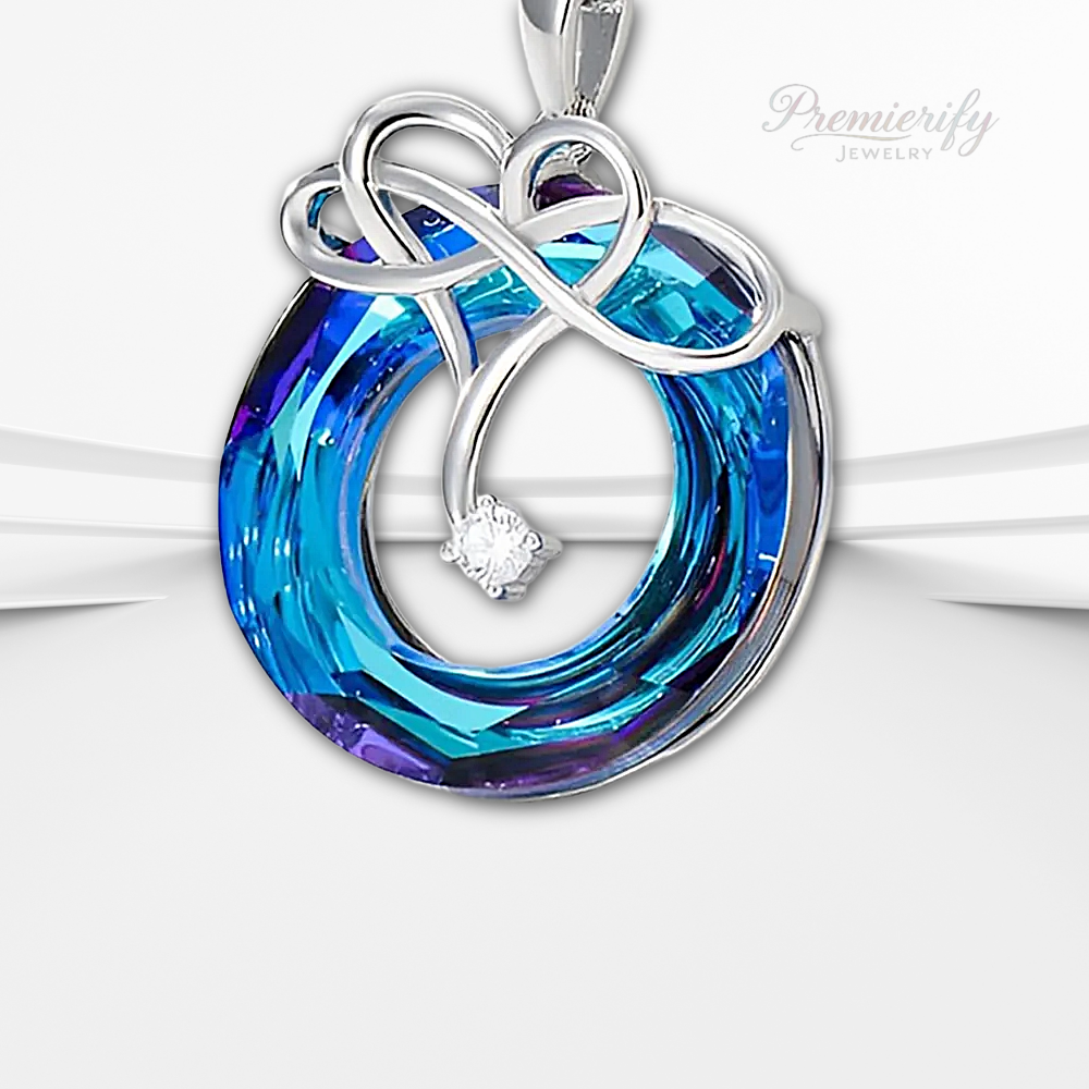 Jewelry pendant with blue and purple swirl design and diamond on a white background, branded 'Premierify'.