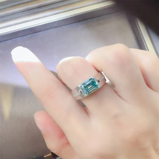 Lume Vert teal-green rectangular moissanite ring set east–west in platinum-plated 925 sterling silver