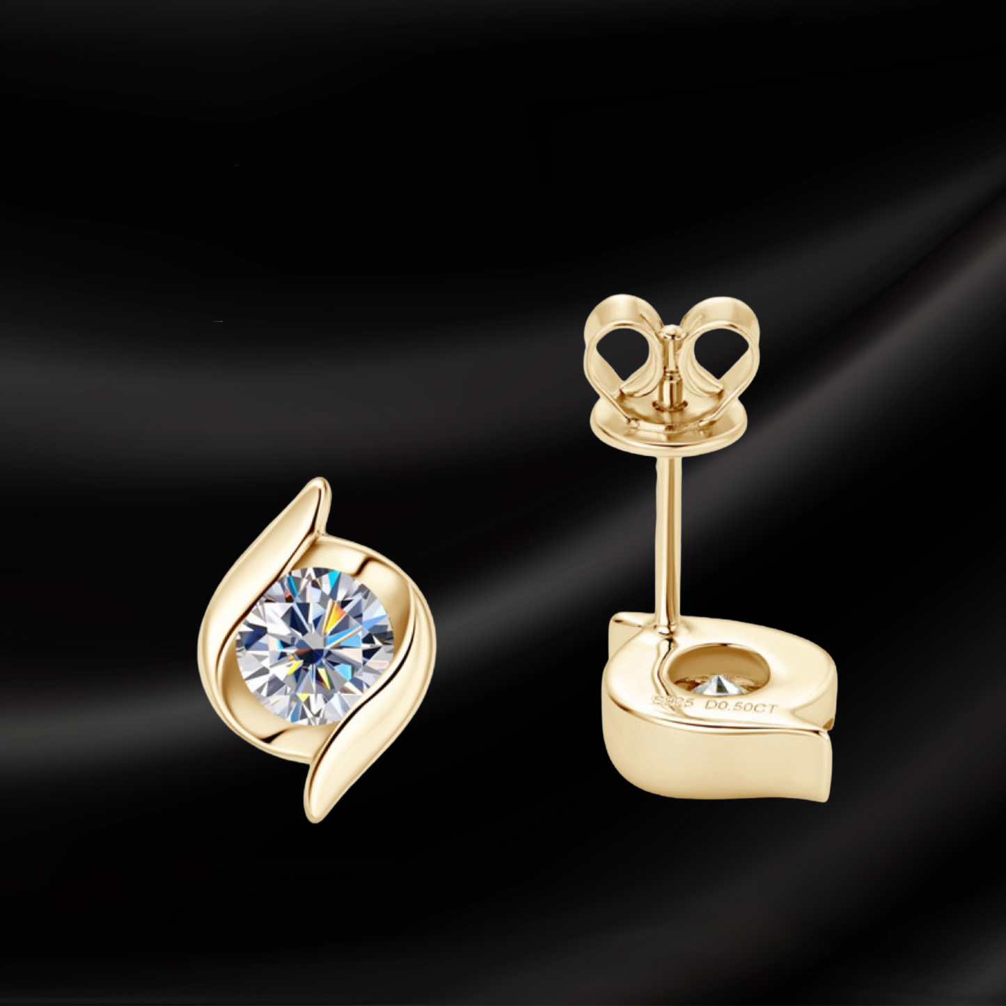 Gold earrings with a central gemstone on a black background