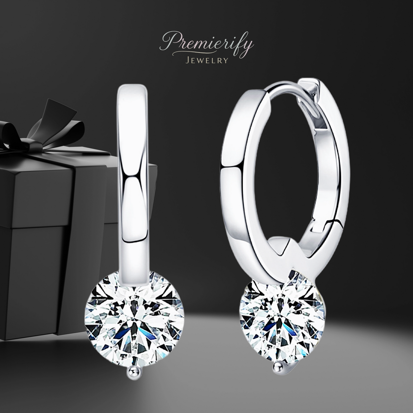 Silver hoop earrings with clear gemstones in front of a gift box, branded 'Premierify Jewelry'.
