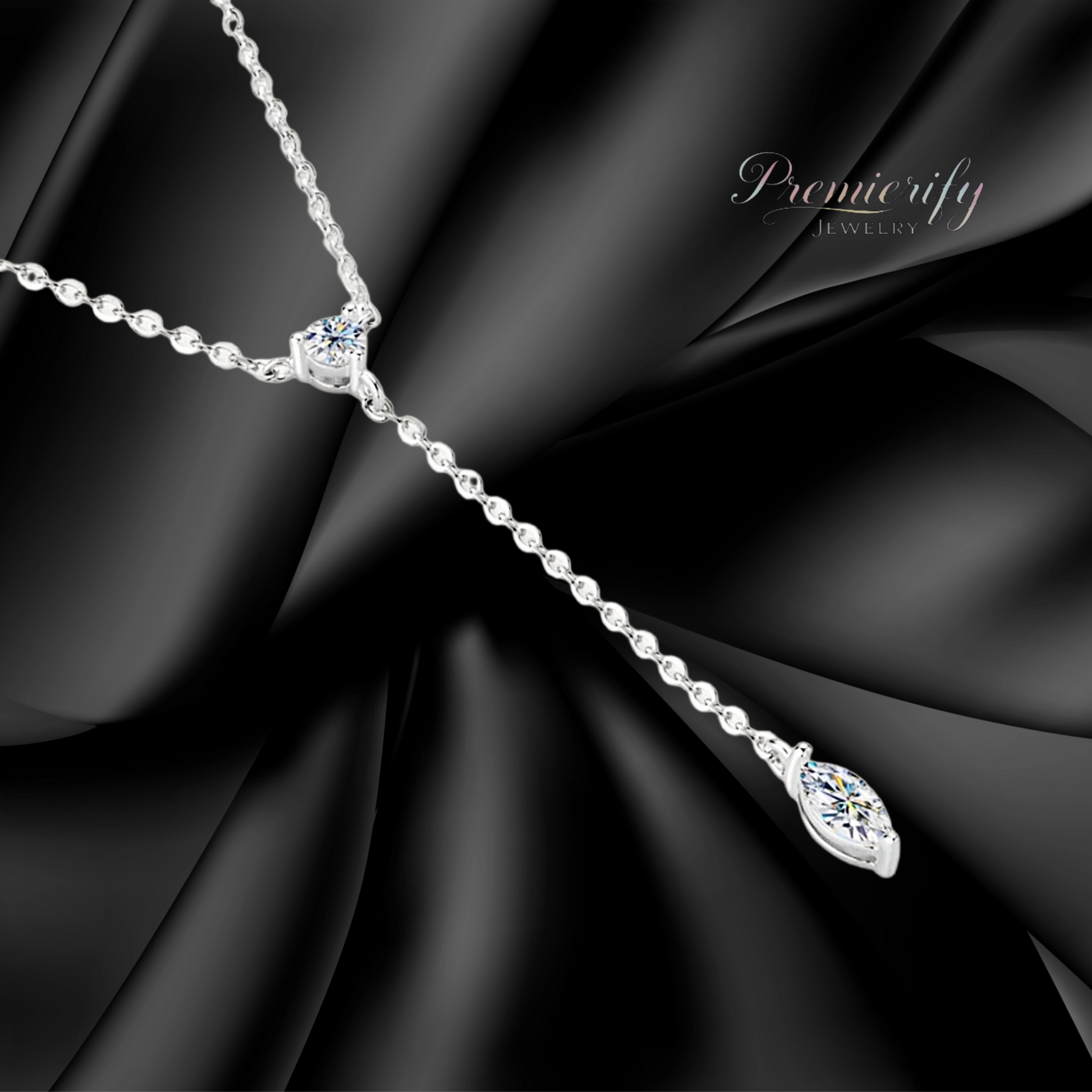 Silver necklace with a pendant on a black fabric background, featuring the brand 'Premierify'.
