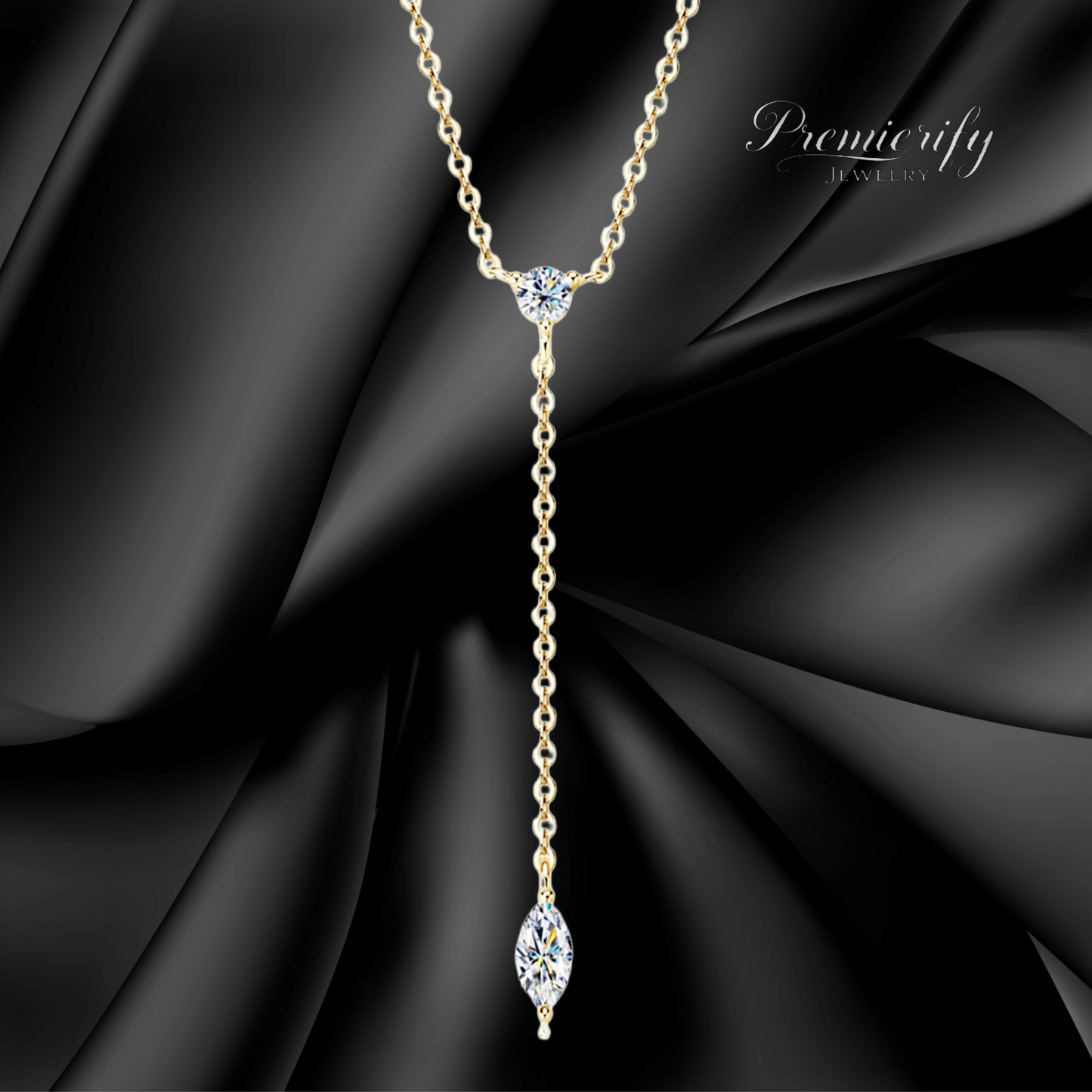 Delicate gold necklace with a diamond pendant on a black fabric background