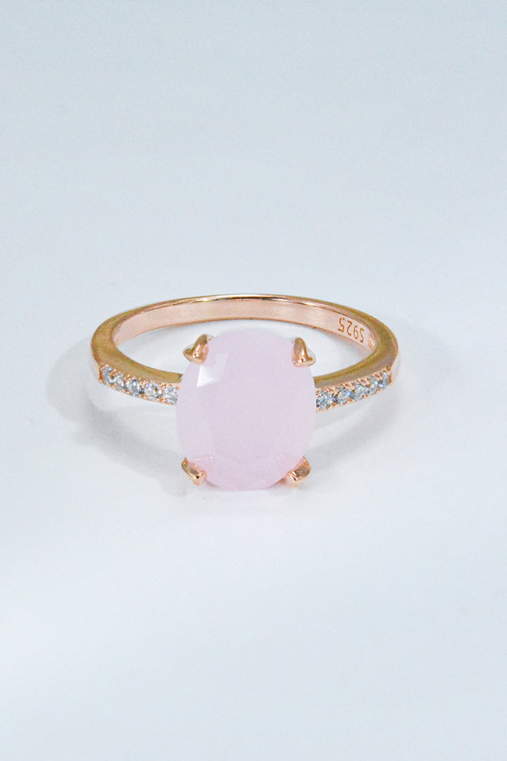 Close-up of rose quartz center with subtle pavé accents