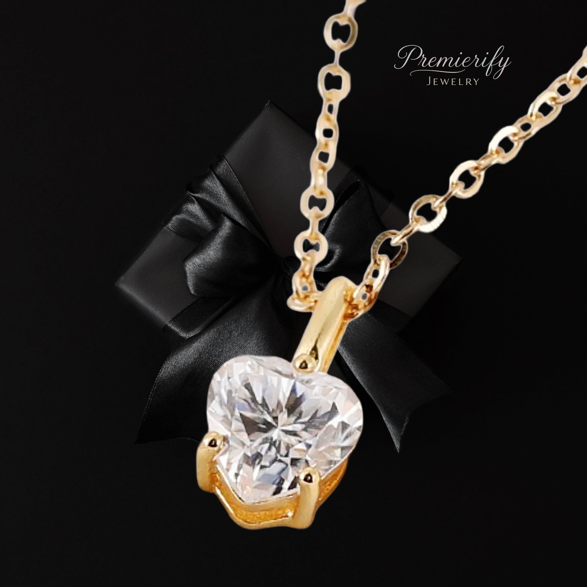 Gold necklace with a heart-shaped diamond pendant on a black background, featuring the brand 'Premierify Jewelry'.