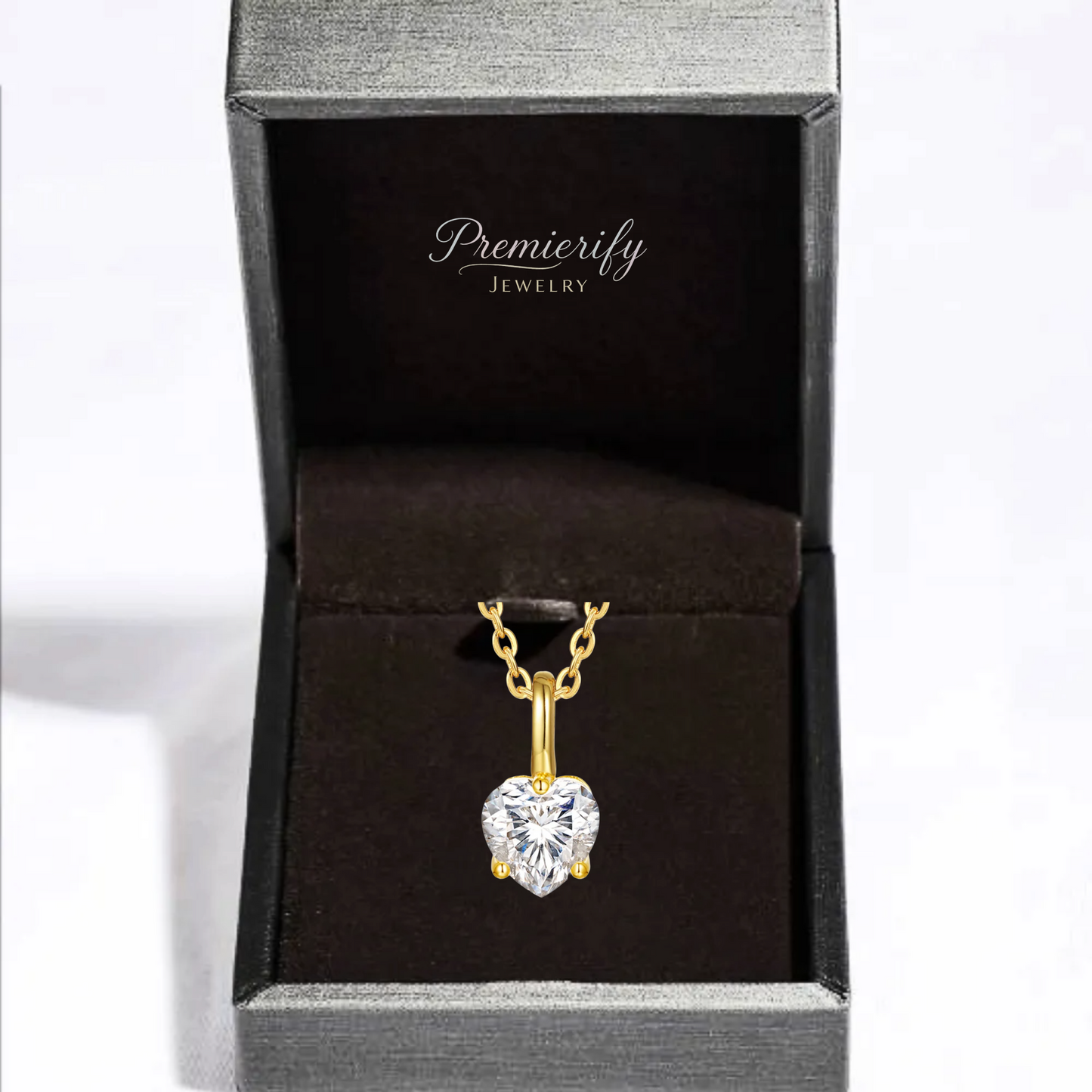 Gold heart-shaped pendant necklace in a Premierify Jewelry box.