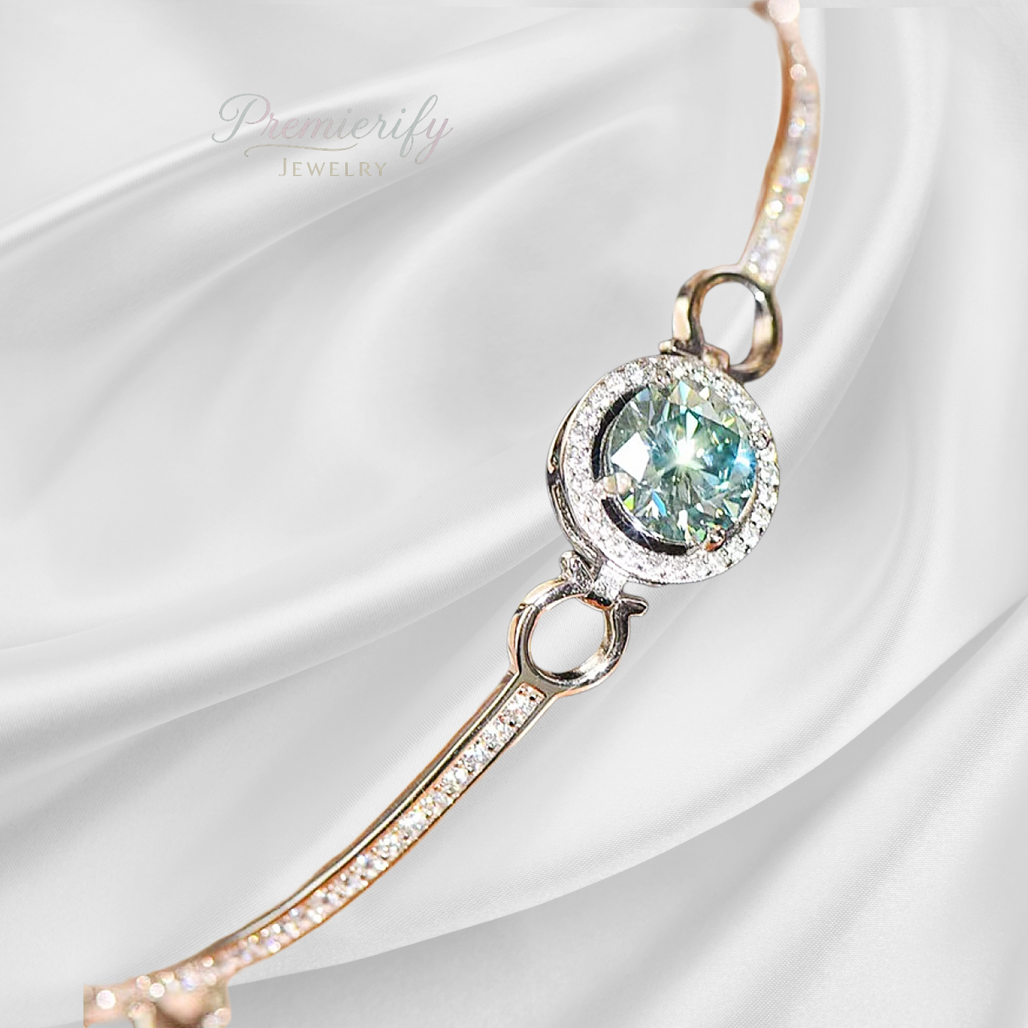 Green halo set moissanite bracelet on white background.