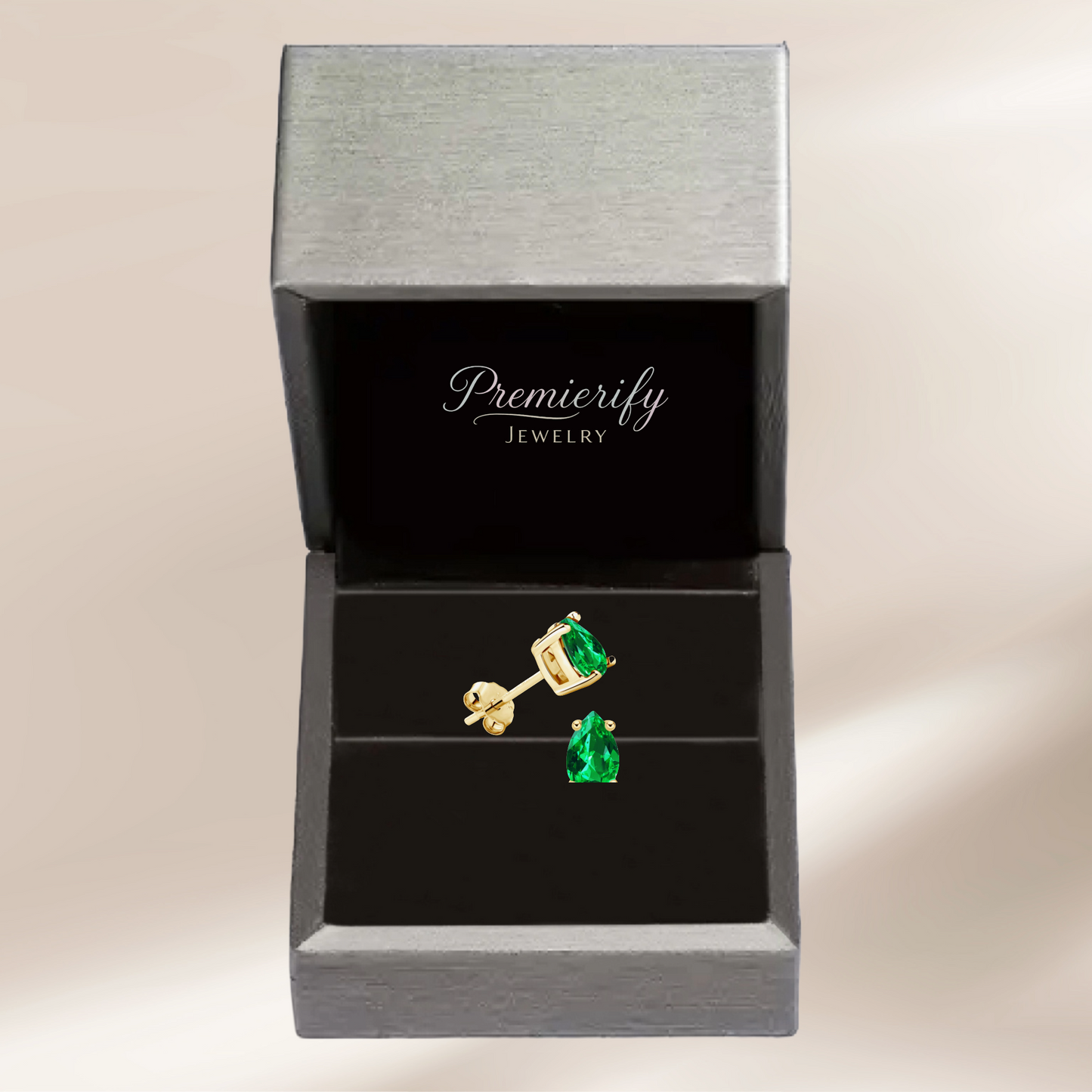 Green gemstone earrings in a Premierify Jewelry box