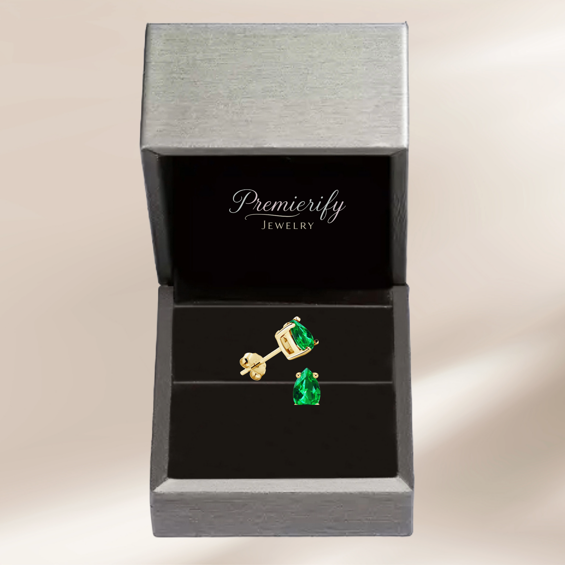 Green gemstone earrings in a Premierify Jewelry box