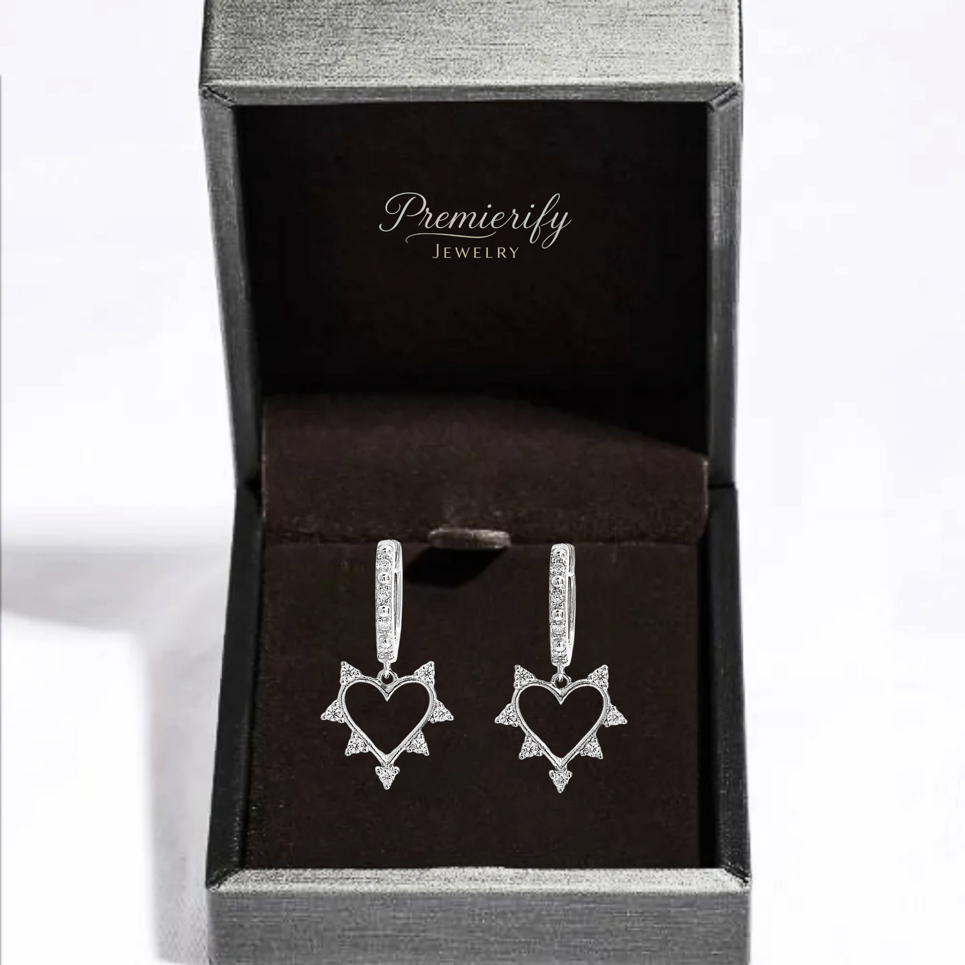 Heart-shaped earrings in a Premierify Jewelry box on a white background