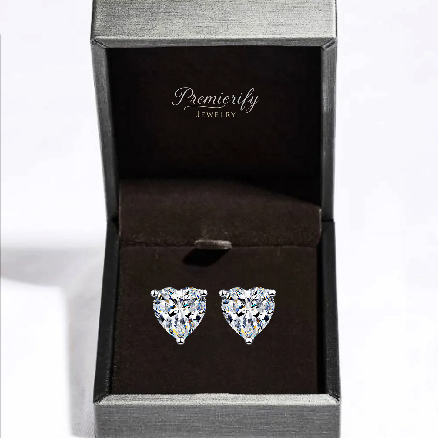 Heart-shaped crystal earrings in a Premierify Jewelry box on a white background