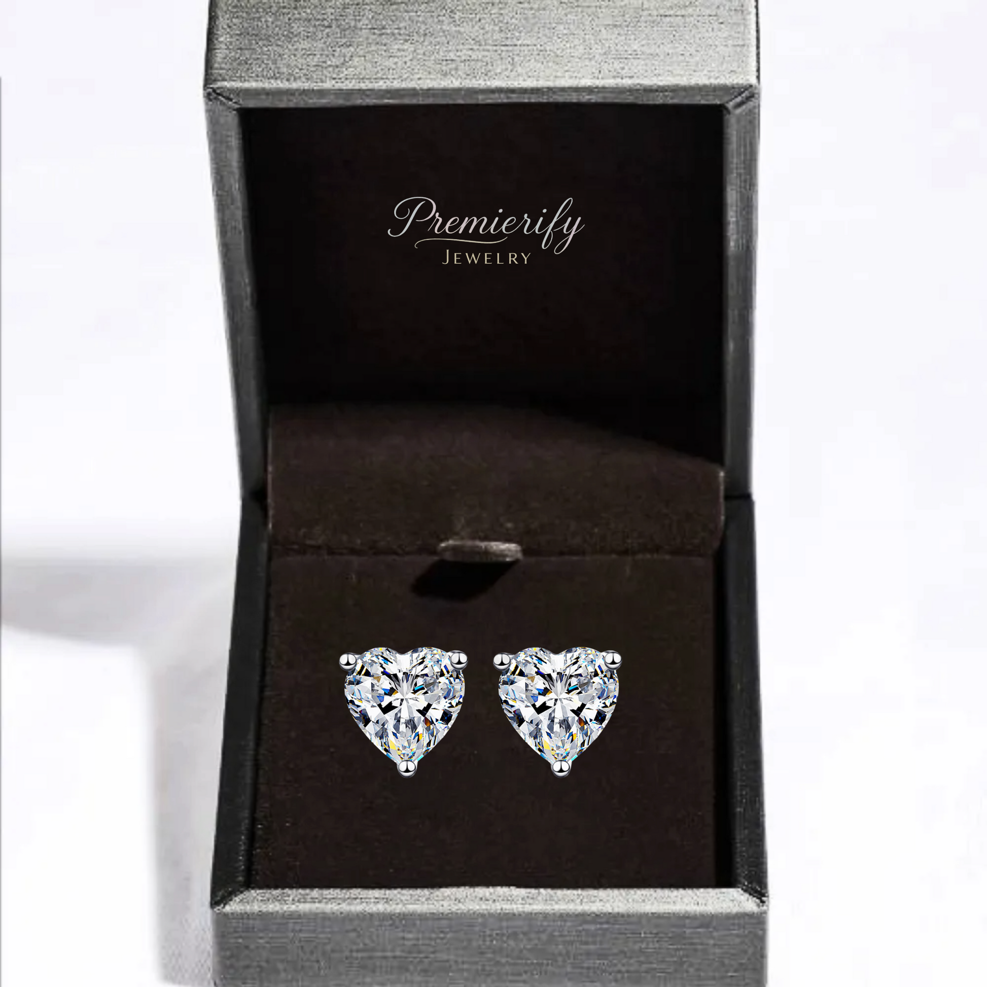 Heart-shaped crystal earrings in a Premierify Jewelry box on a white background