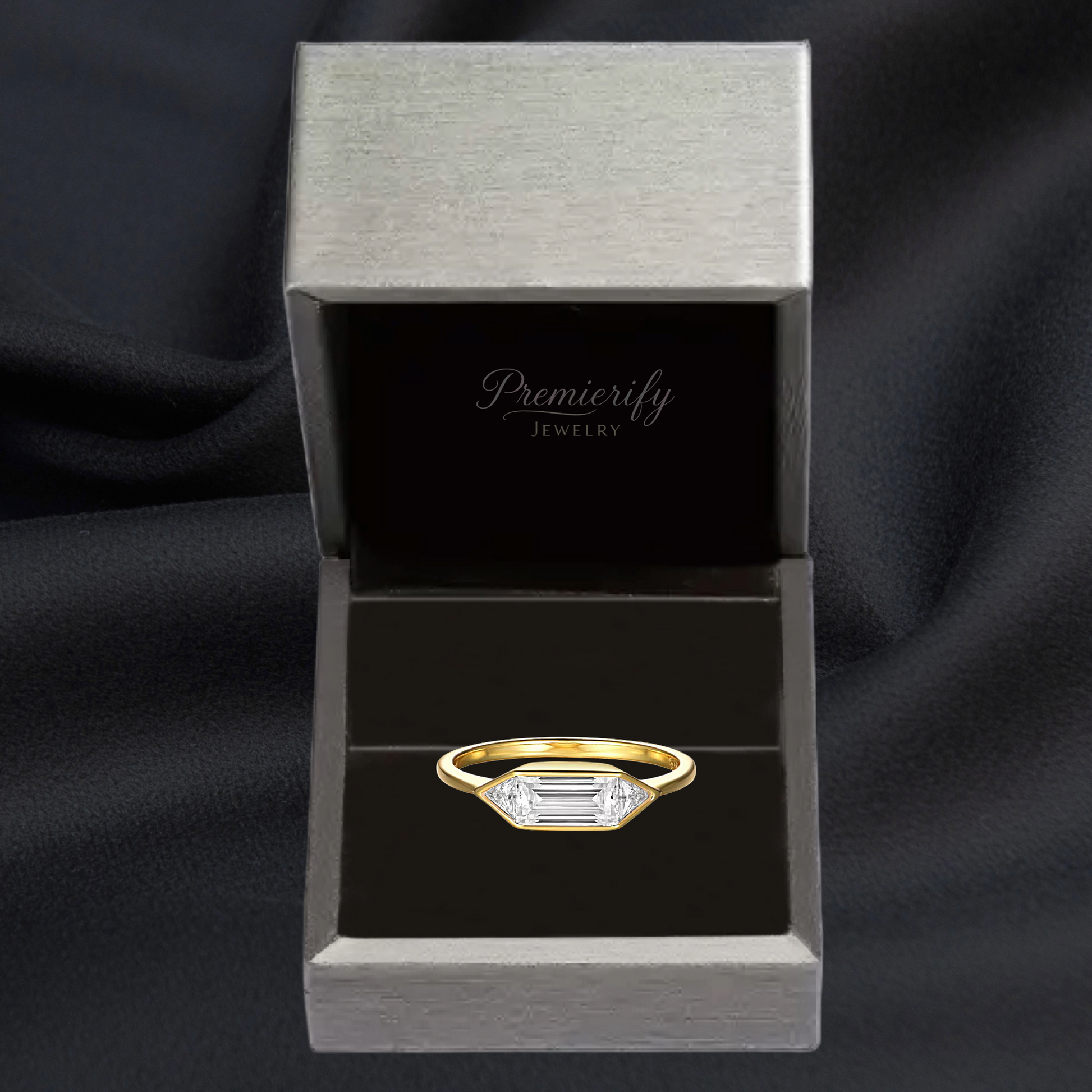 Gold ring with a diamond in a Premierify Jewelry box on a black background