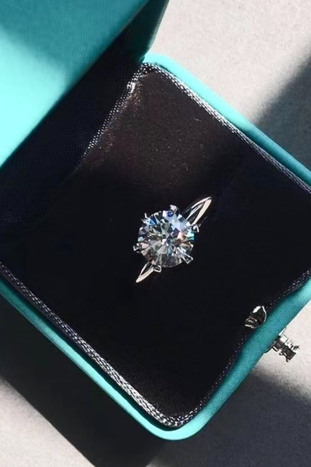 Kaitlyn Ann moissanite solitaire displayed in blue velvet jewelry box – gift-ready packaging