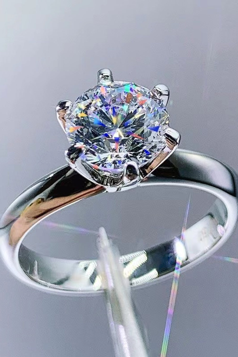 High-shine shot of Kaitlyn Ann™ solitaire ring – 3ct moissanite reflecting rainbow light