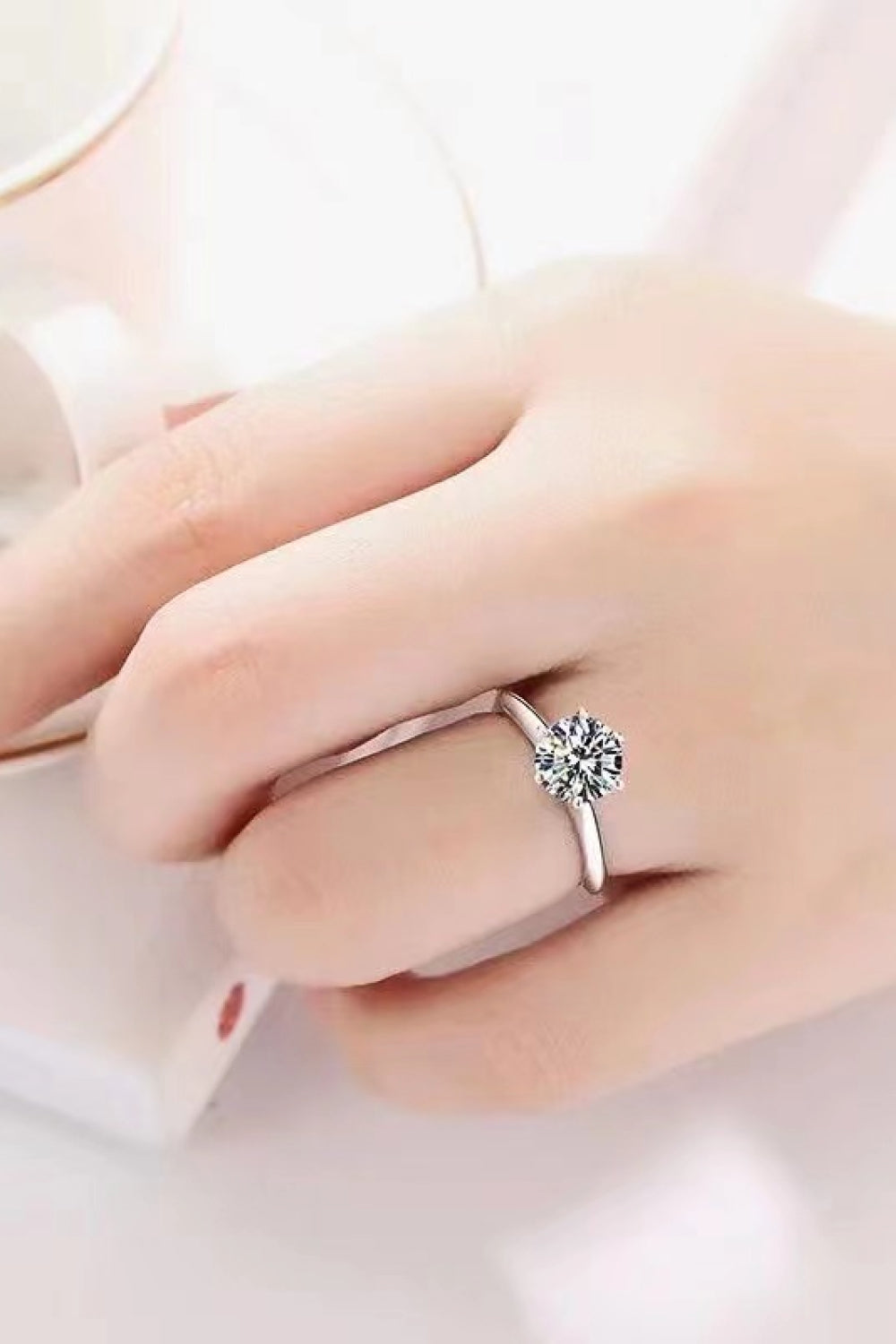 Kaitlyn Ann™ moissanite ring worn on hand – 3 carat stone sparkling in natural light